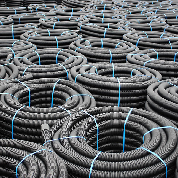 Perforated Land Drainage Coil, designed for efficient water drainage and soil aeration, allowing water to flow into the pipe while preventing soil and debris from entering. Ideal for agricultural, landscaping, and construction applications, this coil helps prevent waterlogging and supports plant health. Image highlights the flexible, durable construction with evenly spaced perforations, ensuring effective water management and easy installation in various drainage systems