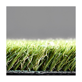 Close-up of artificial grass with a gray background