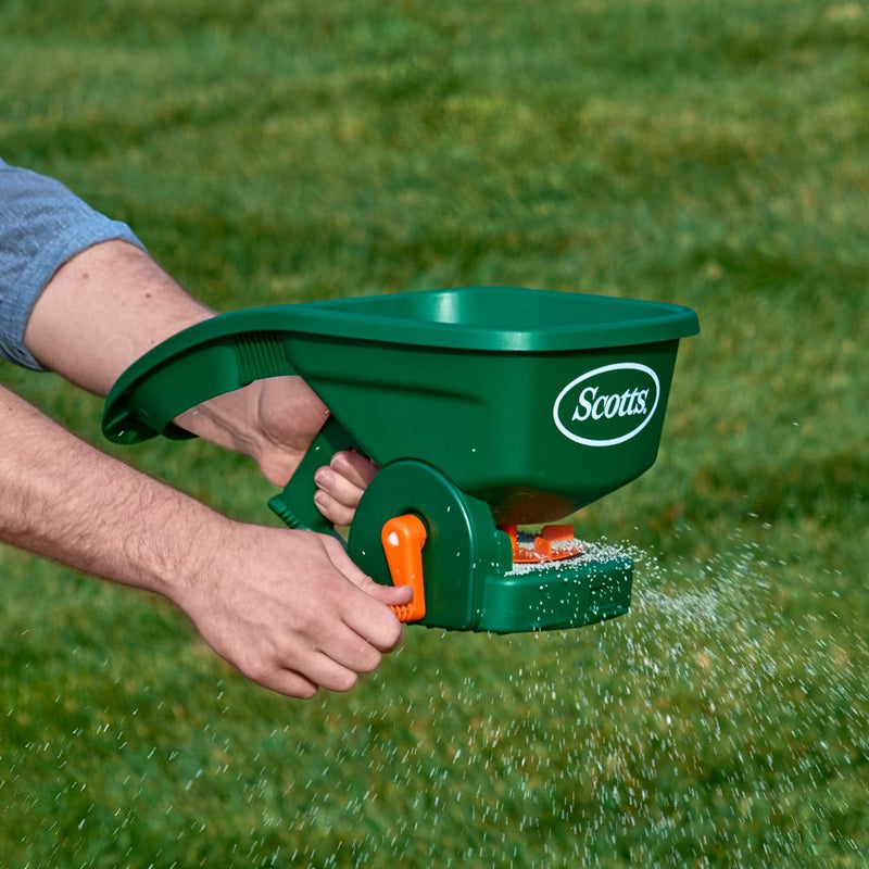 Fertiliser Spreader, designed for evenly distributing fertiliser across lawns, gardens, and agricultural fields to promote healthy plant growth. This tool allows for precise application, ensuring optimal coverage and reducing waste. Image highlights the durable construction, adjustable settings for different fertiliser types, and ergonomic design for easy handling and efficient use